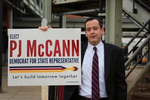 McCann: PJ McCann greeted voters at the JFK-UMass MBTA station this week.            	             Photo by Mike Deehan
